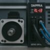 Servo motor and drive with alarm code displayed and DAPPRA logo printed on the drive front panel.